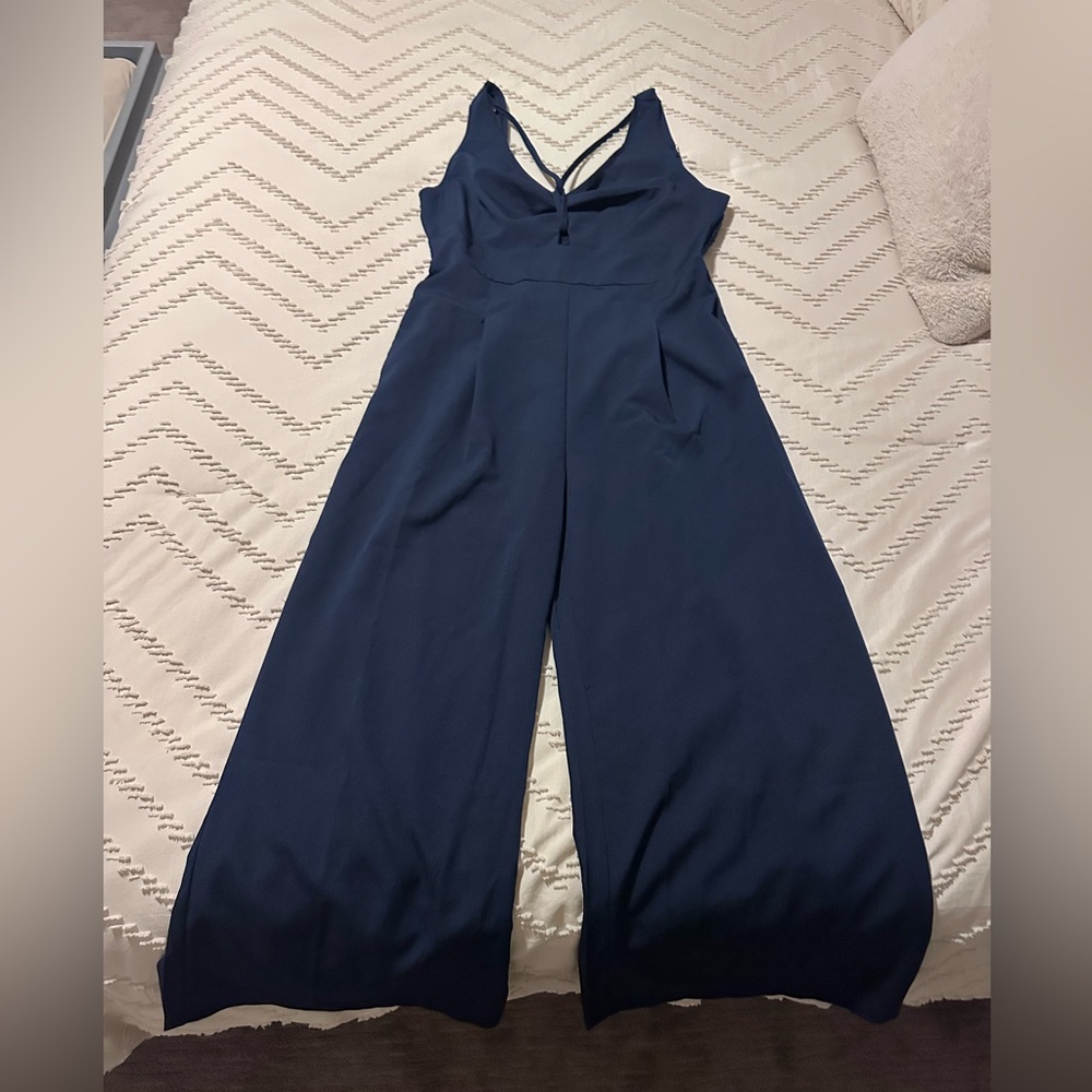 Navy romper with chest strap and keyhole detail